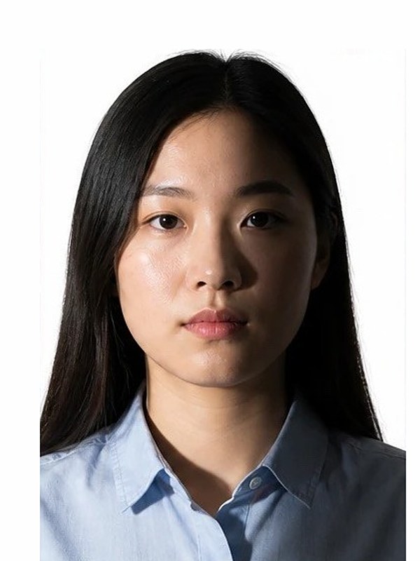 Rejected DV photo: heavy shadow and uneven lighting across the face